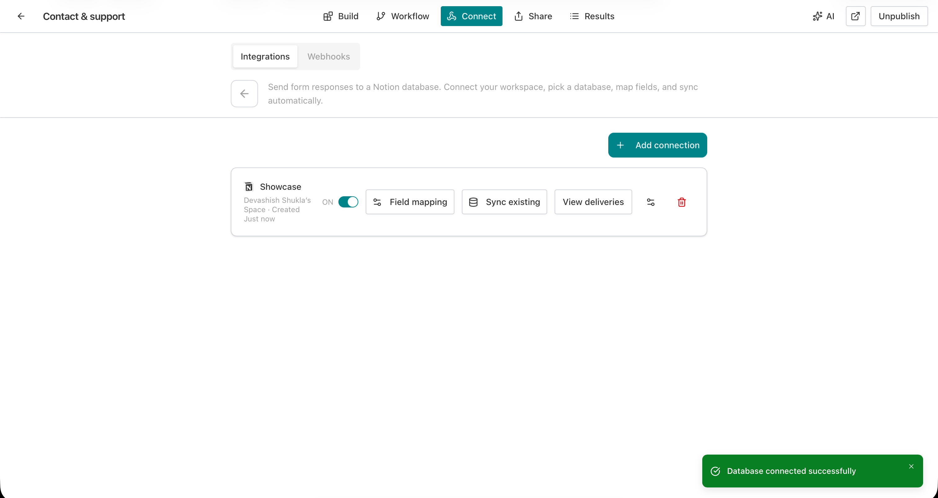 AntForms Notion connected state showing Showcase database with Field mapping, Sync existing, and View deliveries buttons